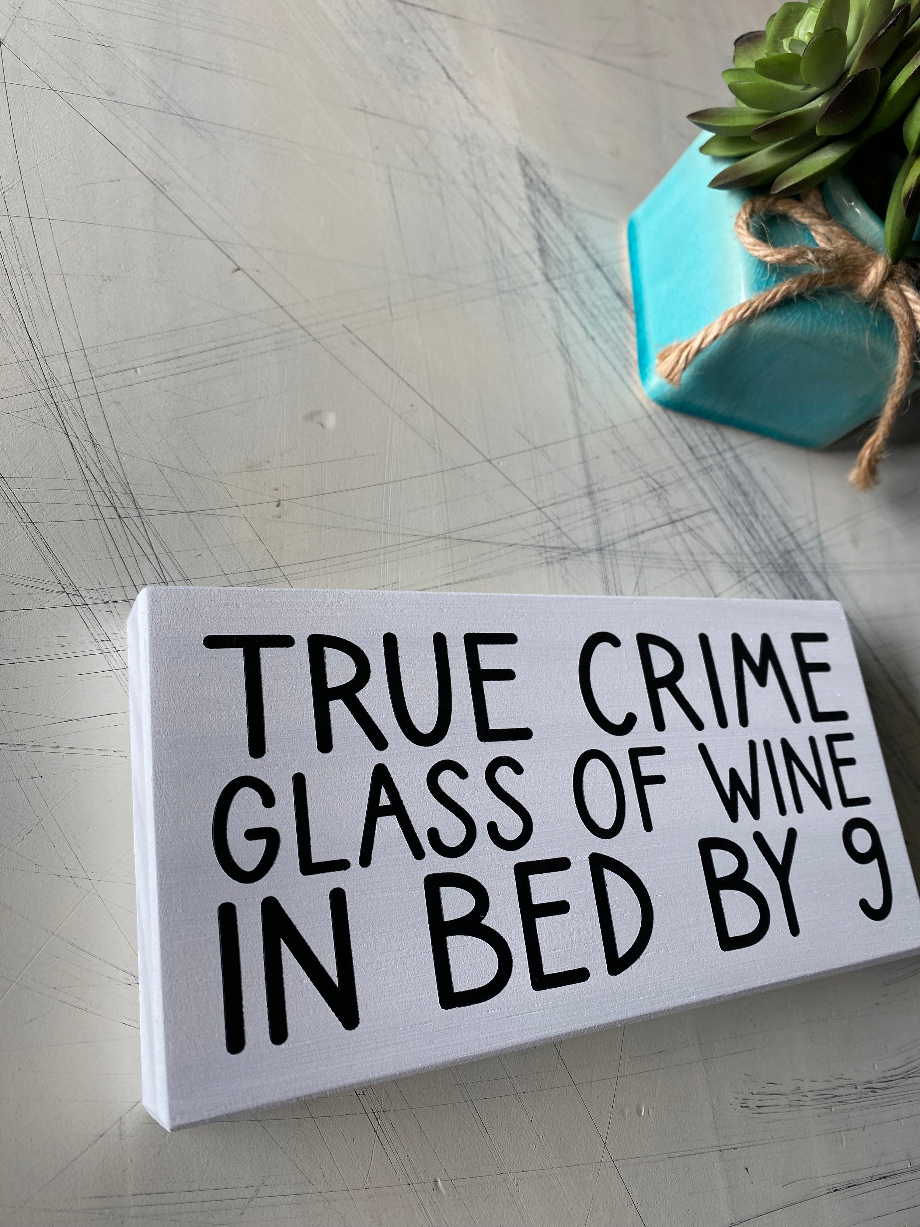 True crime glass of wine in bed by 9