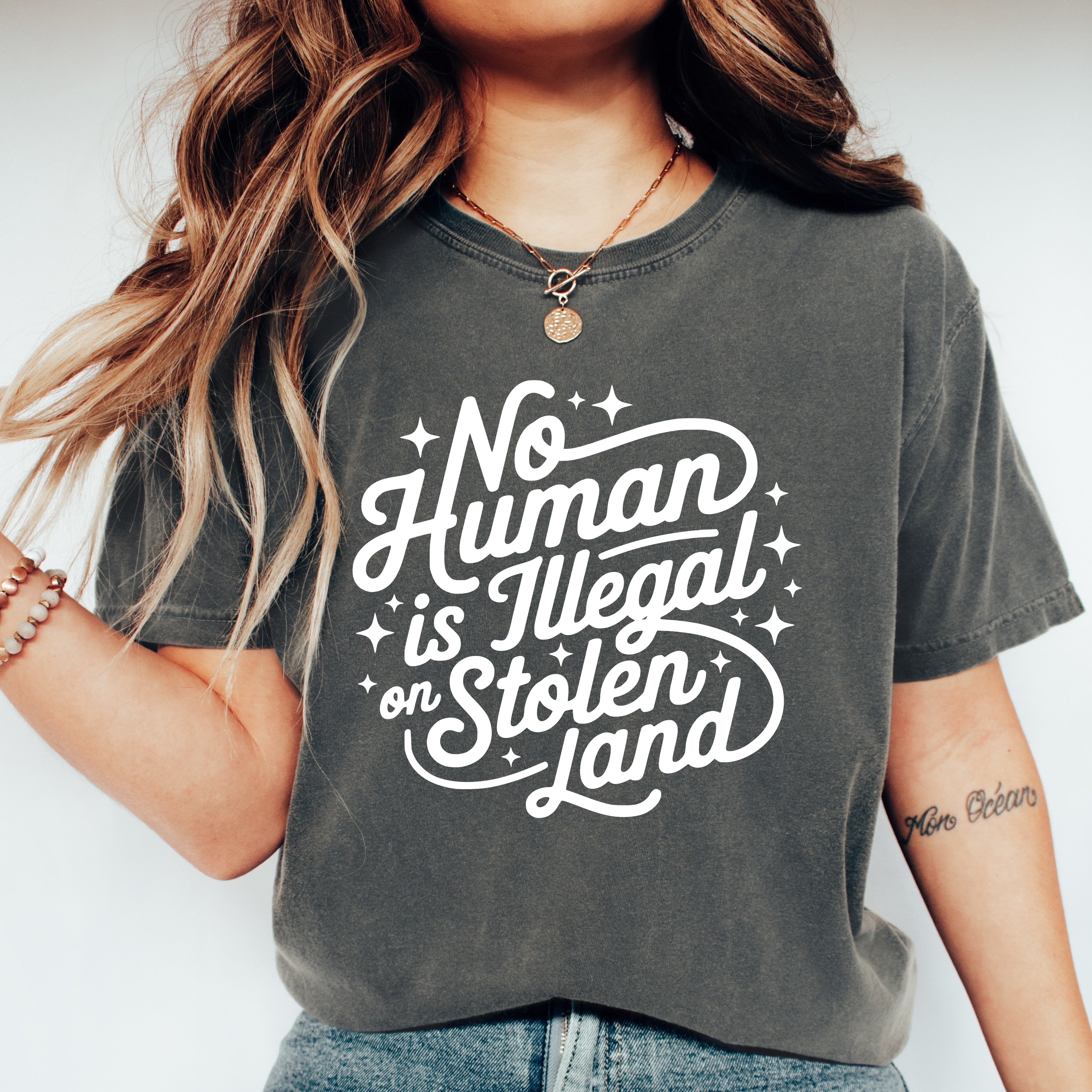 No Human Is Illegal on Stolen Land Graphic Tee