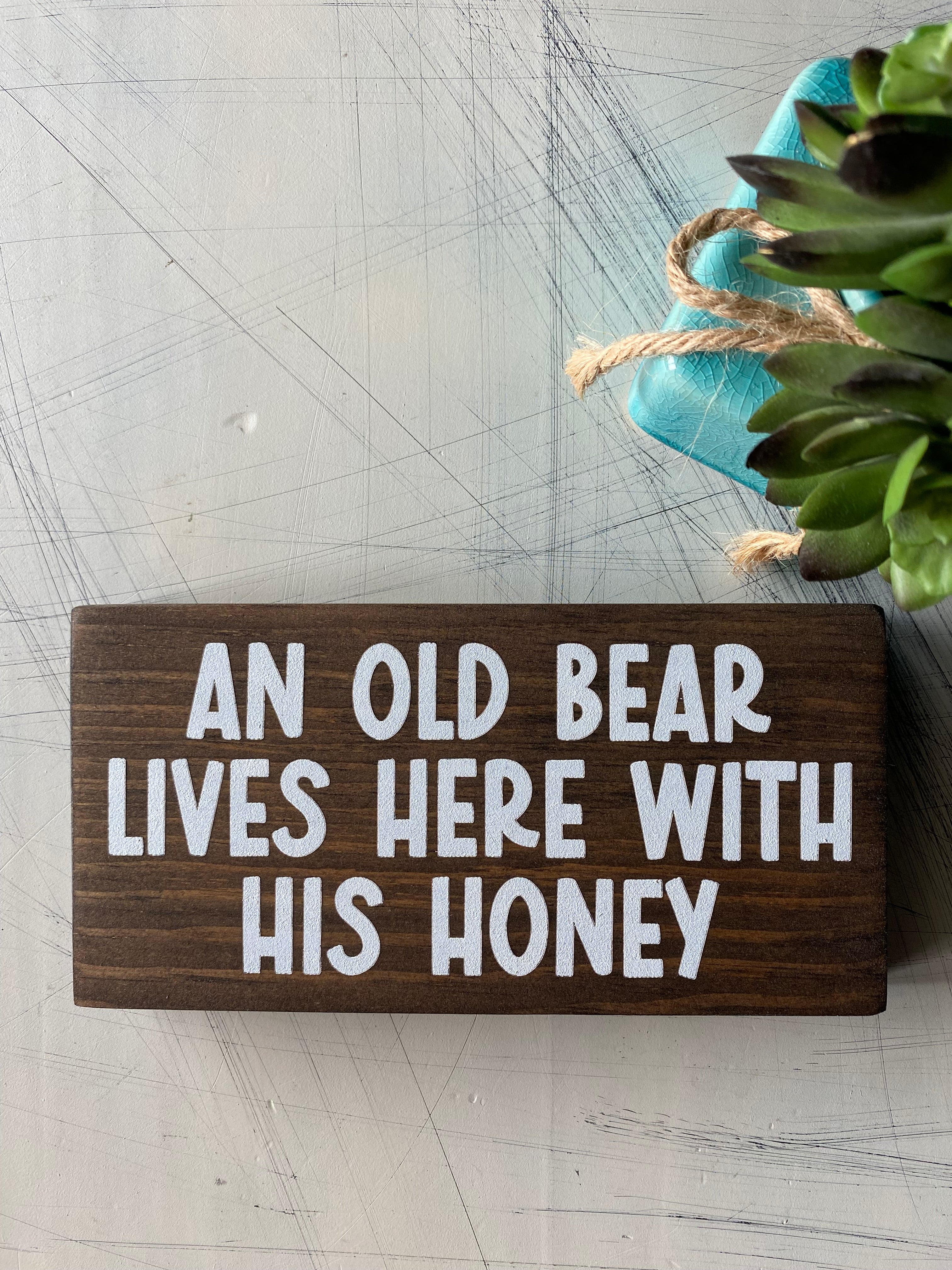 An old bear lives here with his honey