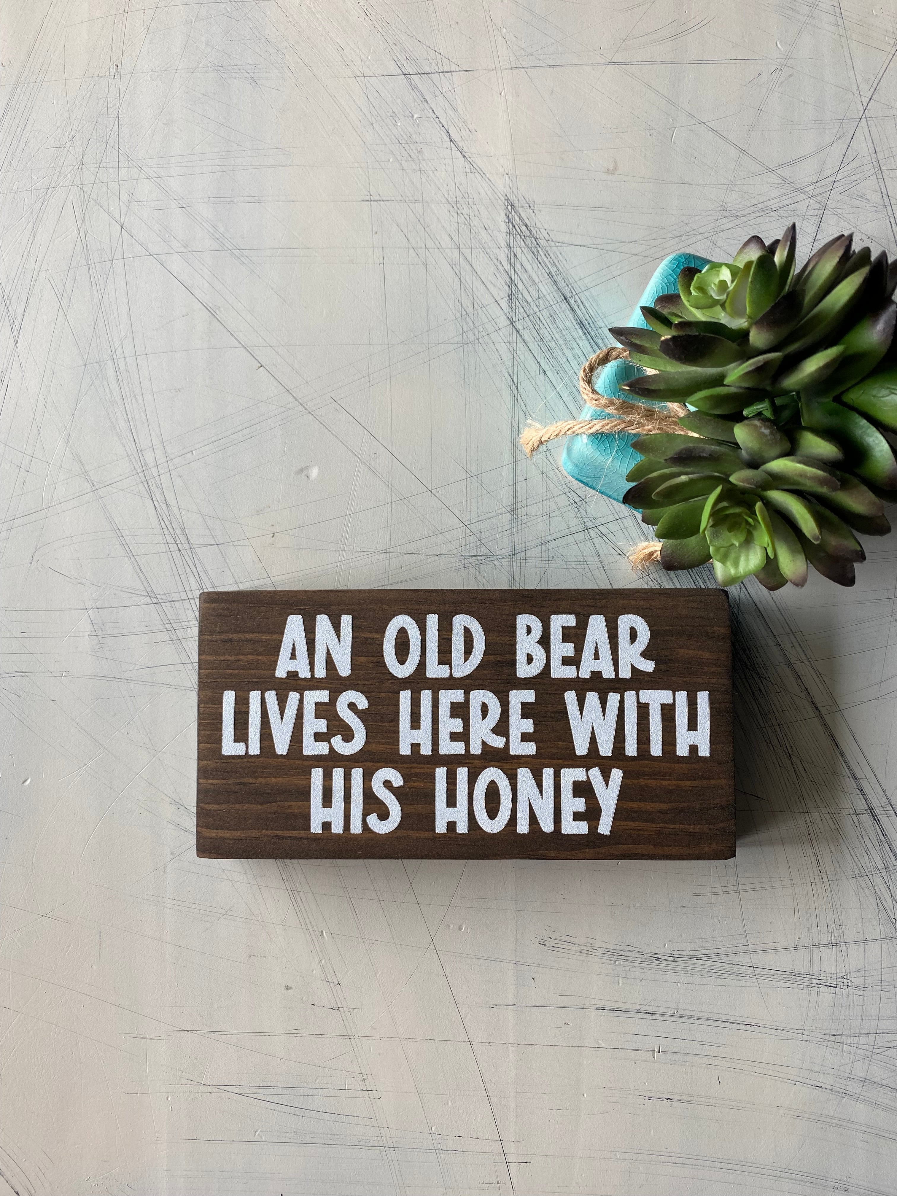 An old bear lives here with his honey